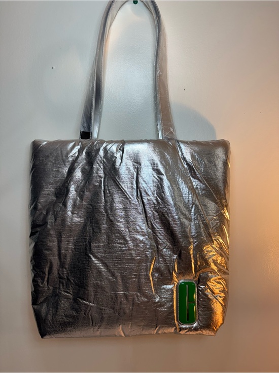 Clinique Handbags - CLINIQUE PUFFY SILVER TOTE BAG WITH GREEN INSIDE LINING